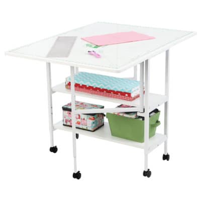 White Dixie Cutting Table (3401) from Arrow Sewing Furniture opened with MAT-C Cutting Mat and sewing accessories
